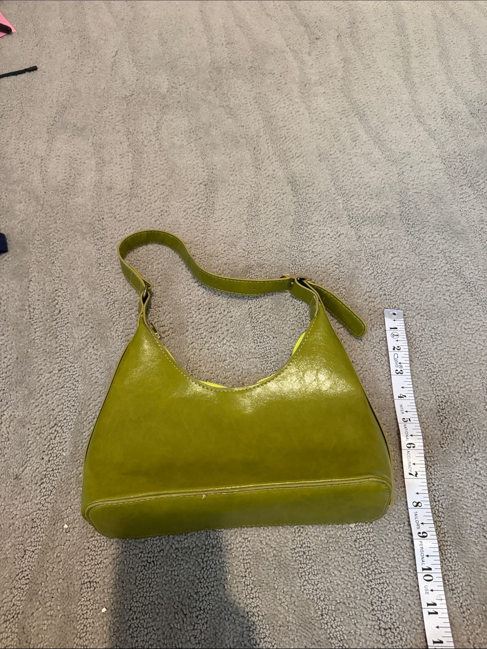 Structured green shoulder bag with zipper inside